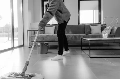 Professional cleaner working across a large interior floor